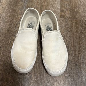 All white slip on vans
